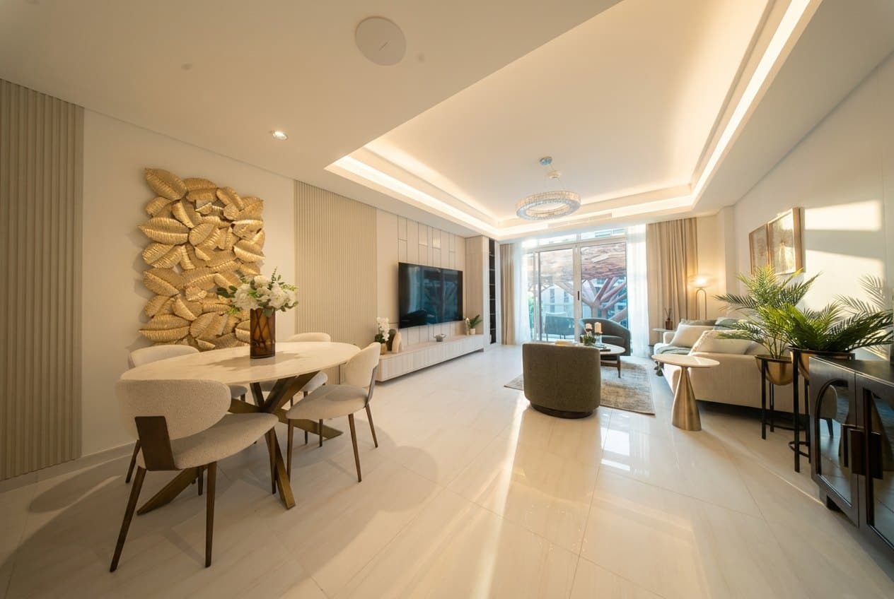 Furnished open-plan living and dining room in an apartment at The Pearl Island, Doha