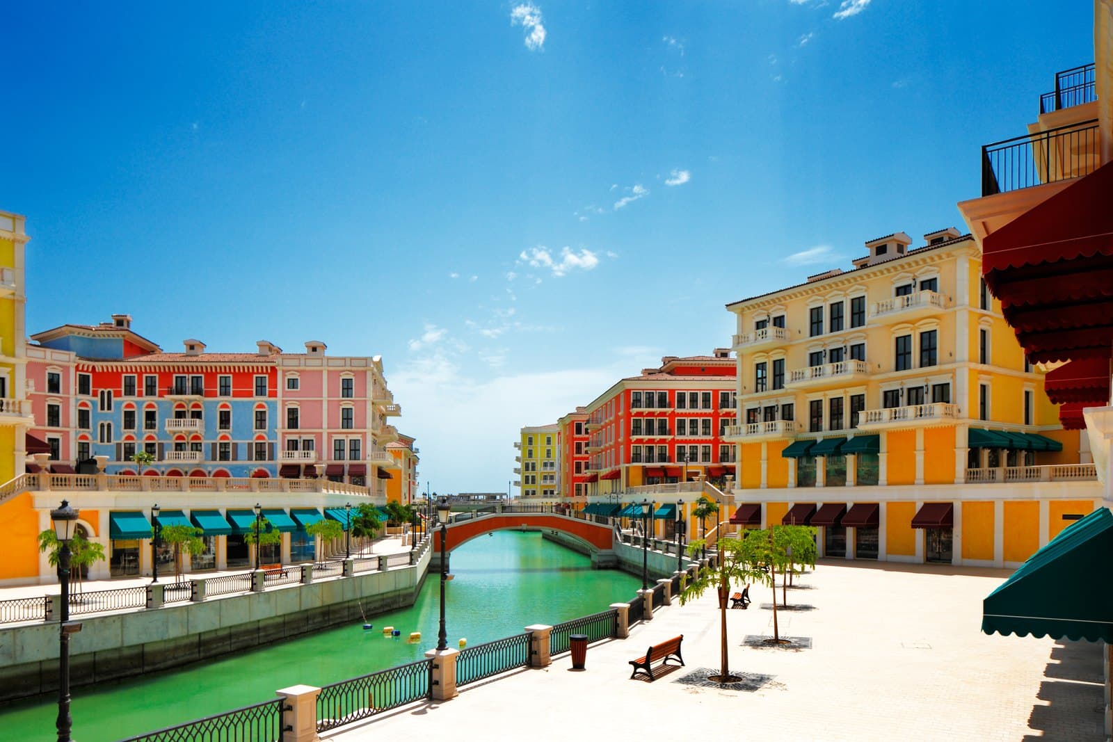 Pastel buildings, canal and bridge at Qanat Quartier, The Pearl Island, Doha